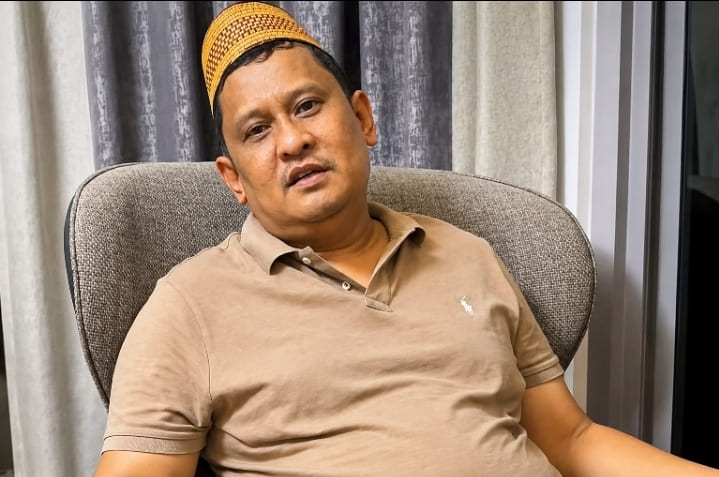 Khairul Umam alias Haji Her.