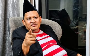 Khairul Umam alias Haji Her.